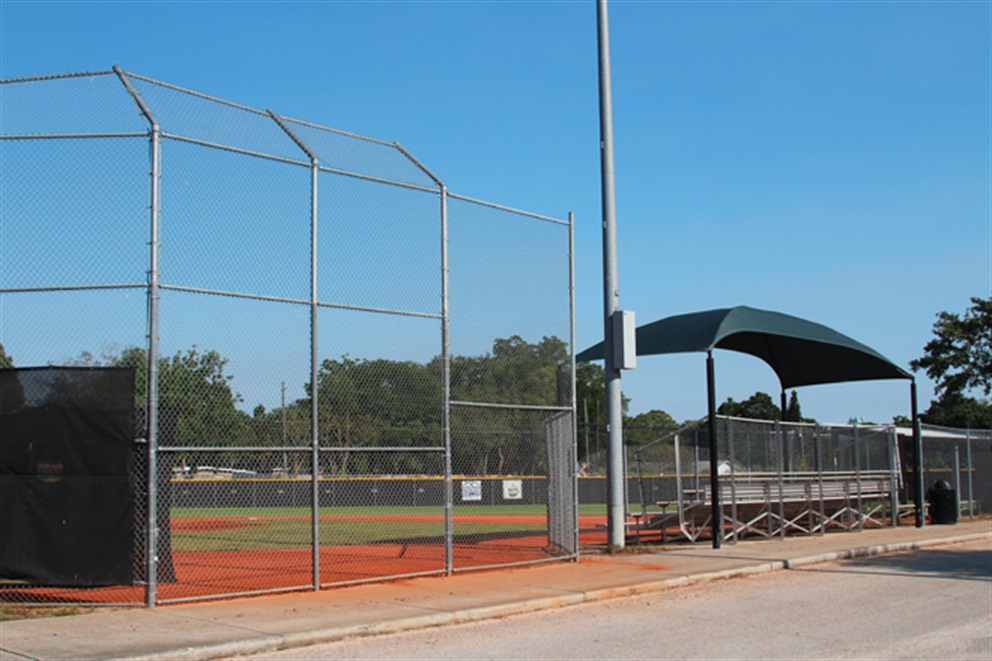 Baseball field with stadium seats in the background.