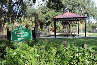 Pleasant Valley Park sign with pavilion behind